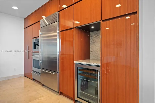 a bathroom with a shower and a glass door