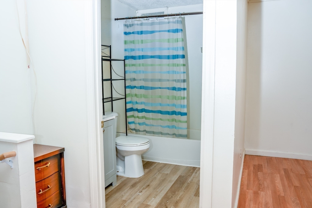 118 Jefferson Street Fall River, MA 02721 - Photo 11 of 34 a bathroom with a toilet and a shower