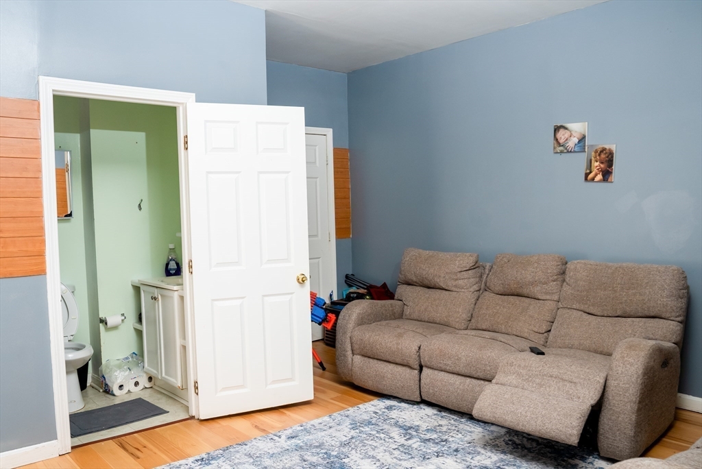 118 Jefferson Street Fall River, MA 02721 - Photo 14 of 34 a living room with furniture and a couch