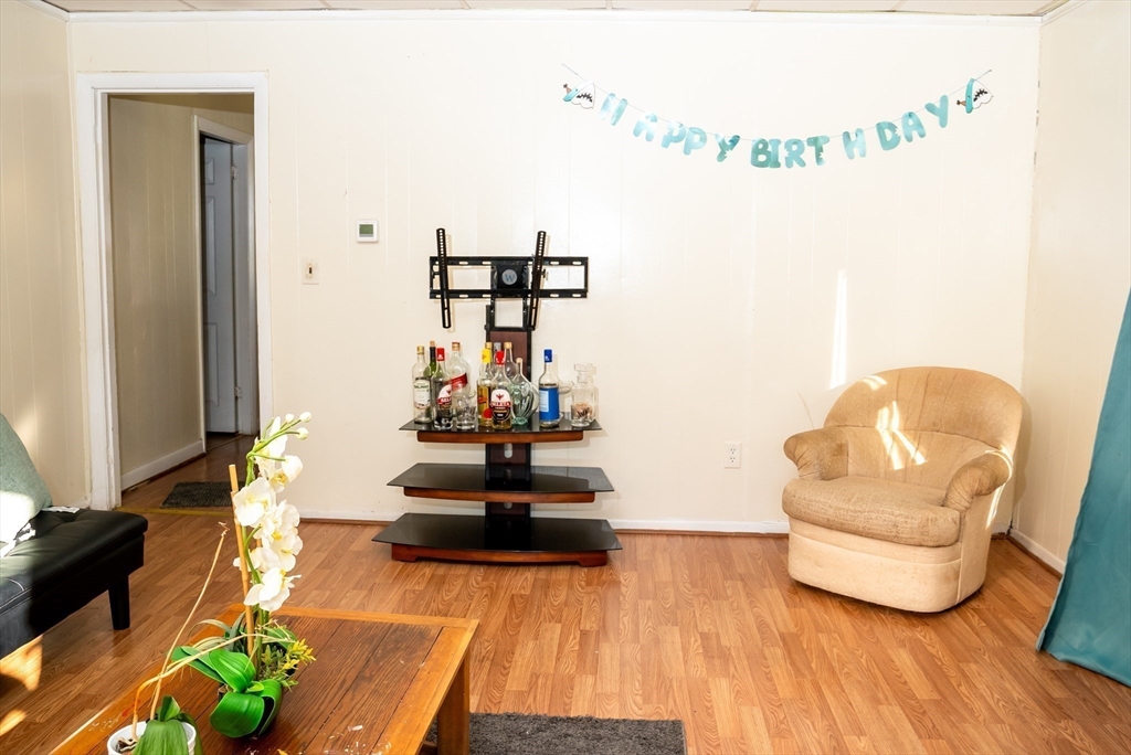 118 Jefferson Street Fall River, MA 02721 - Photo 20 of 34 a living room with furniture and a wooden floor