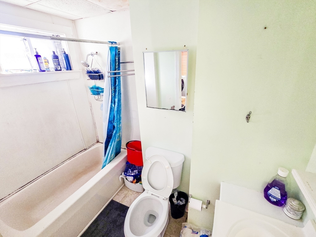 118 Jefferson Street Fall River, MA 02721 - Photo 24 of 34 a bathroom with a bath tub and a toilet