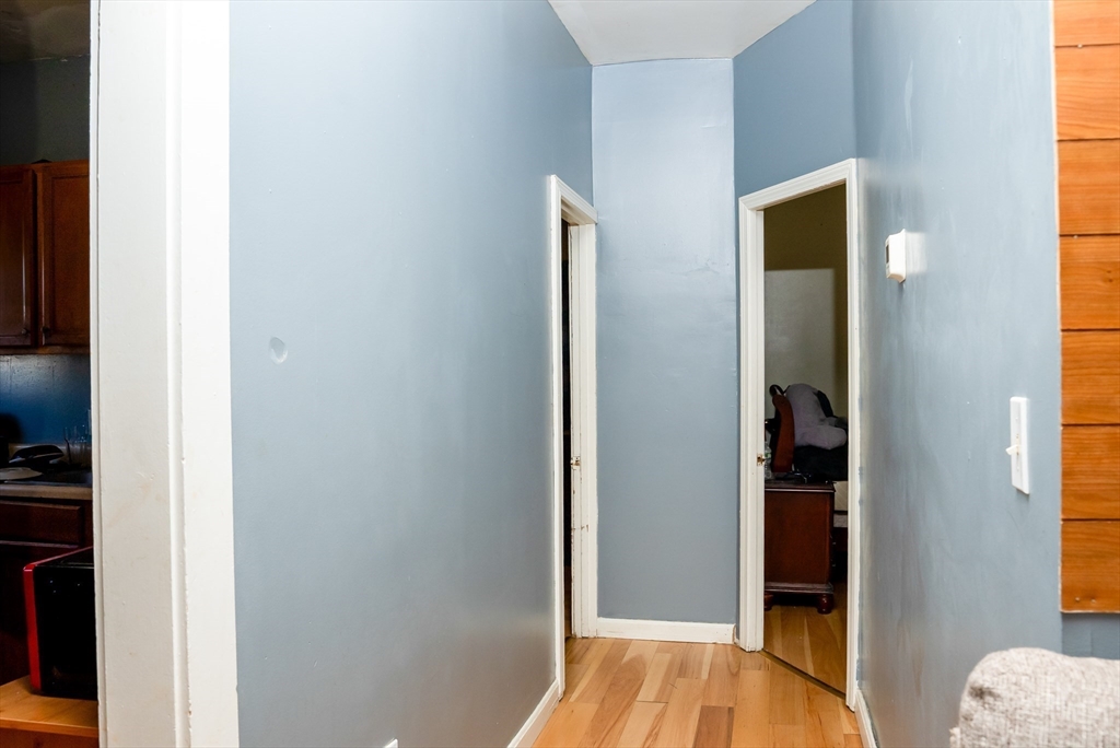 118 Jefferson Street Fall River, MA 02721 - Photo 26 of 34 a view of a hallway with wooden floor and closet
