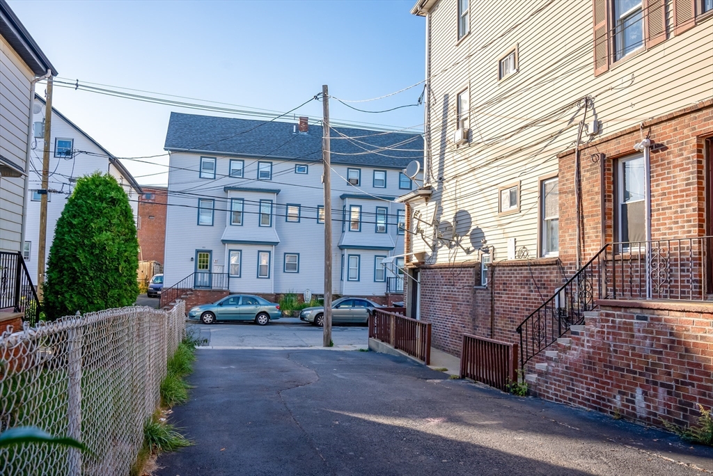 118 Jefferson Street Fall River, MA 02721 - Photo 28 of 34 a view of a building with a yard