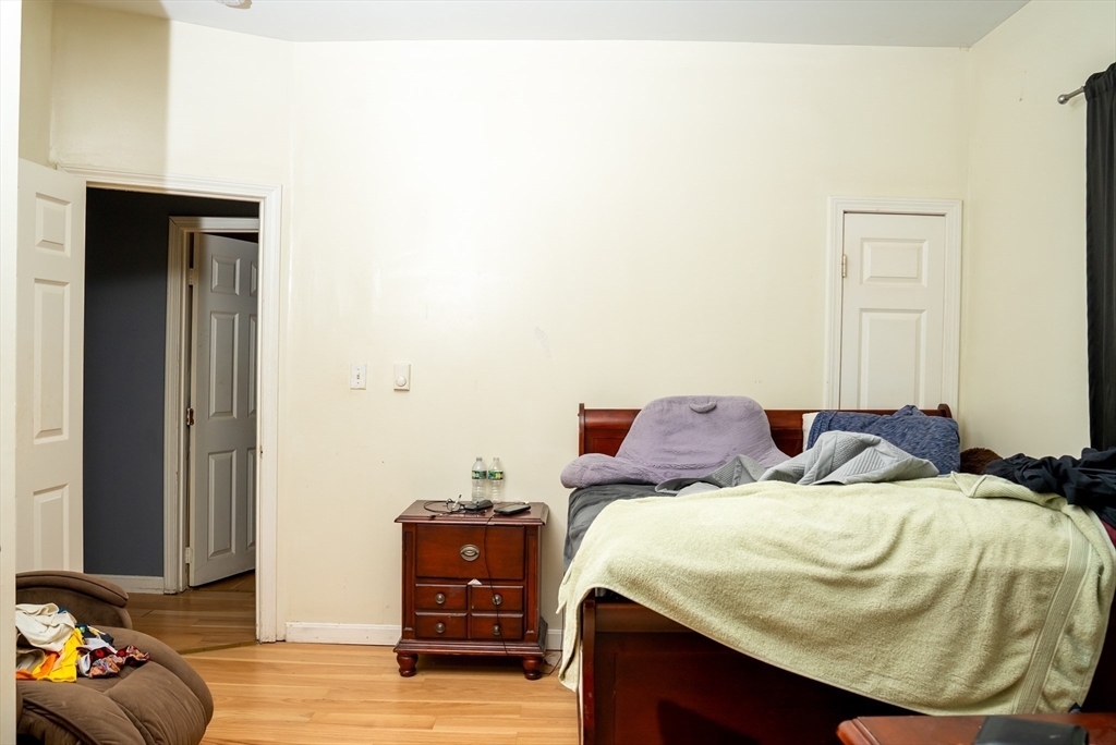 118 Jefferson Street Fall River, MA 02721 - Photo 29 of 34 a bedroom with a bed and a mirror