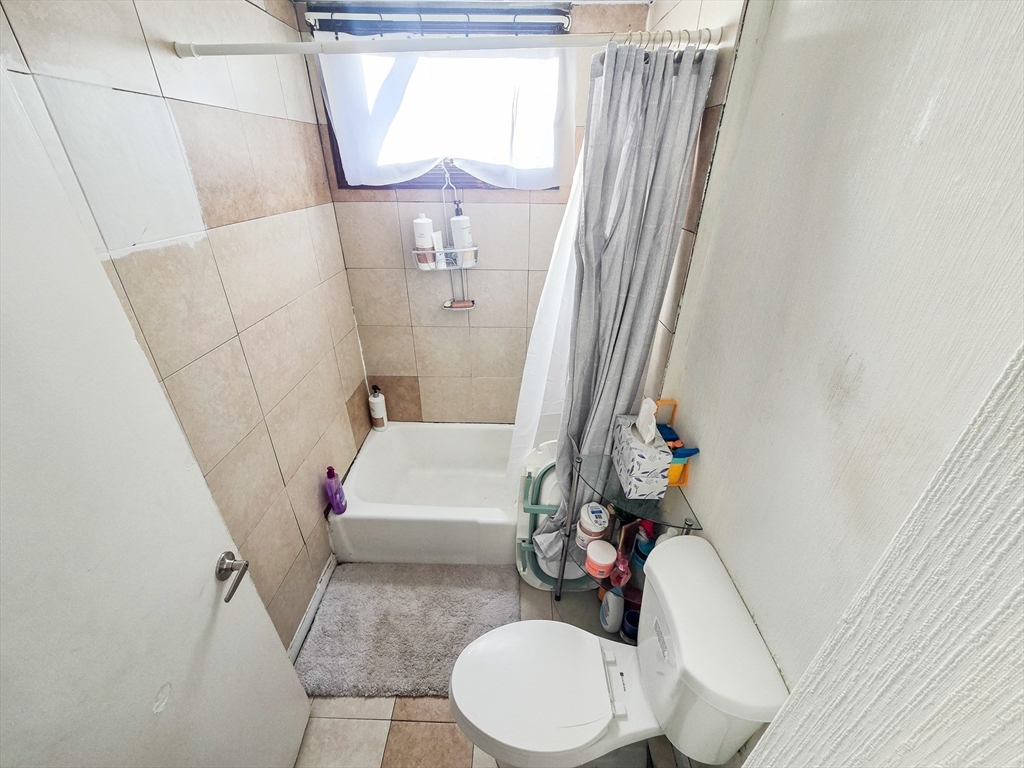 118 Jefferson Street Fall River, MA 02721 - Photo 30 of 34 a bathroom with a sink a toilet and tub