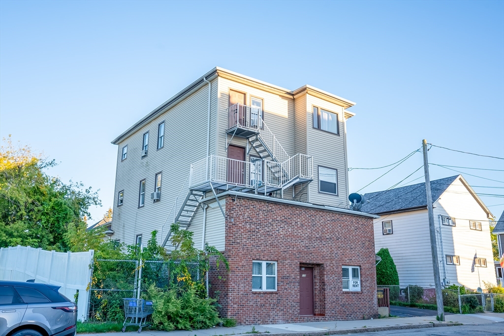 118 Jefferson Street Fall River, MA 02721 - Photo 34 of 34 a brick building with a large windows