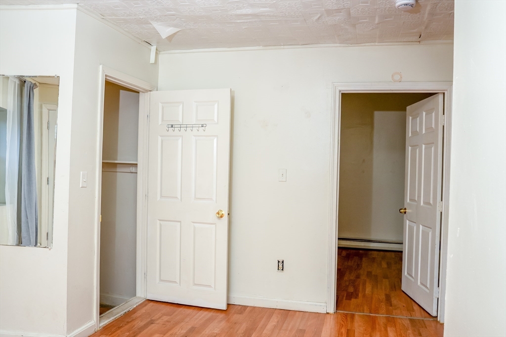 118 Jefferson Street Fall River, MA 02721 - Photo 8 of 34 a view of a hallway with wooden floor