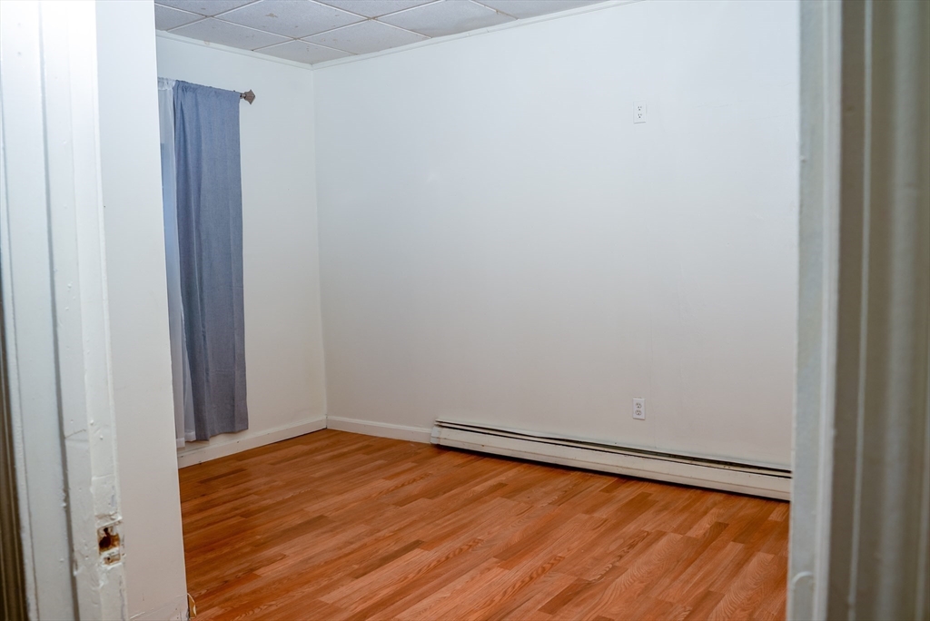 118 Jefferson Street Fall River, MA 02721 - Photo 9 of 34 a view of a room with wooden floor