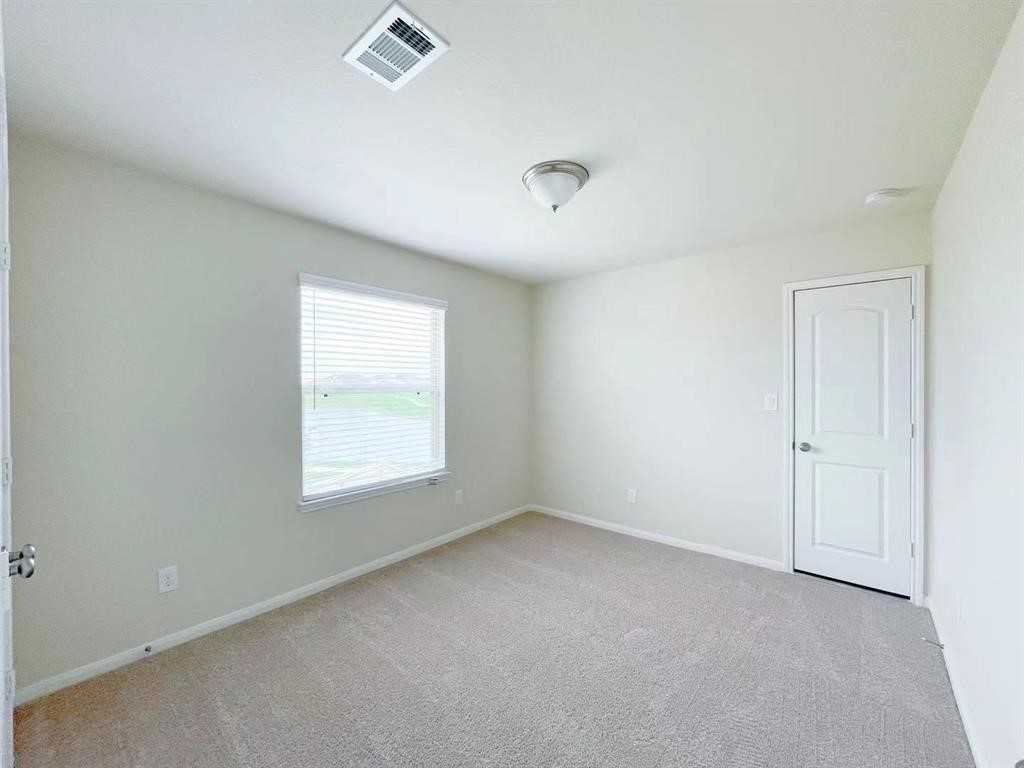 4403 Silvergrass Lane Katy, TX 77493 - Photo 18 of 26 an empty room with a window