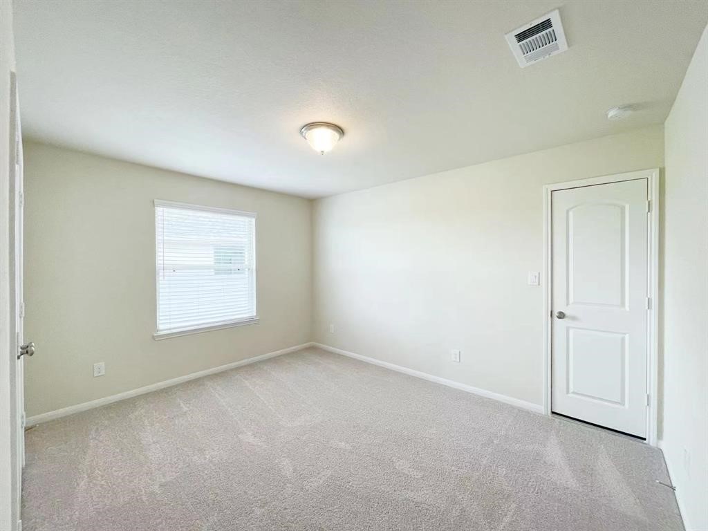 4403 Silvergrass Lane Katy, TX 77493 - Photo 23 of 26 an empty room with a window