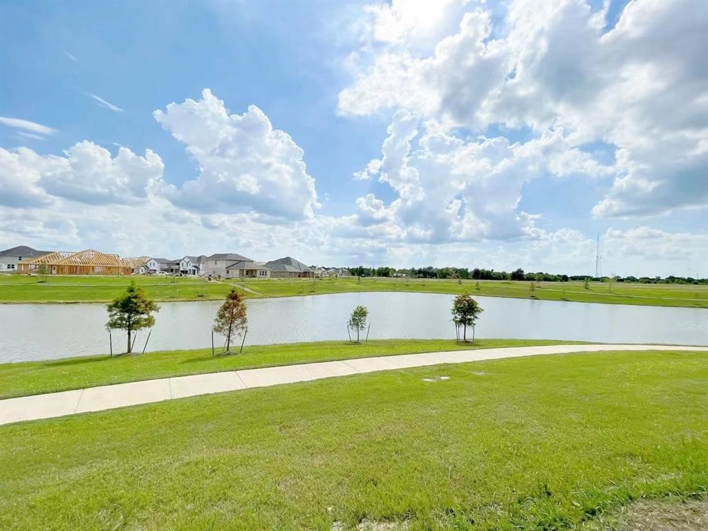 4403 Silvergrass Lane Katy, TX 77493 - Photo 26 of 26 a view of a lake with houses in the back