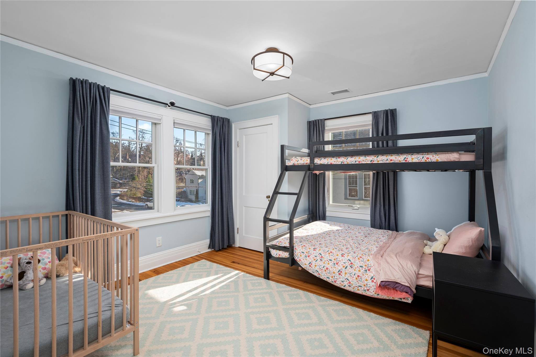 123 Ellison Avenue Bronxville, NY 10708 - Photo 15 of 27 a bedroom with a bed and window