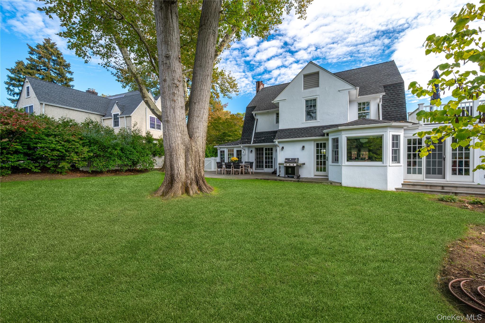 123 Ellison Avenue Bronxville, NY 10708 - Photo 22 of 27 a front view of a house with a yard