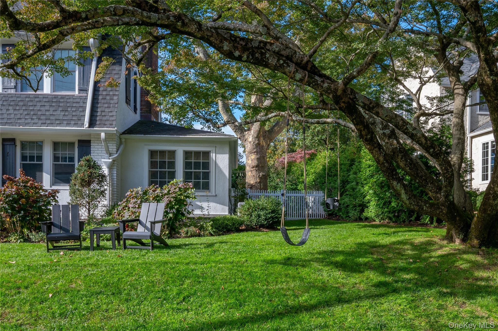 123 Ellison Avenue Bronxville, NY 10708 - Photo 23 of 27 a view of house with backyard and a slide