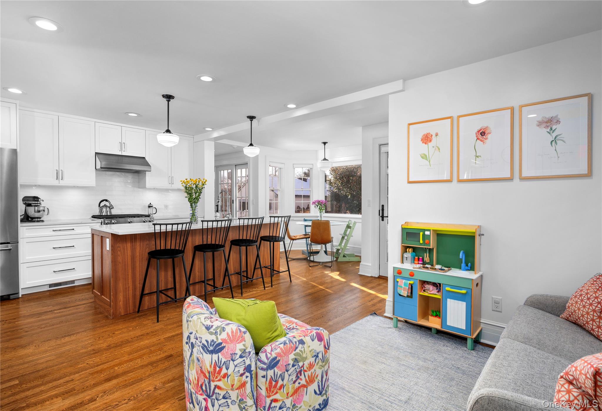 123 Ellison Avenue Bronxville, NY 10708 - Photo 5 of 27 a living room with kitchen island furniture and a kitchen view