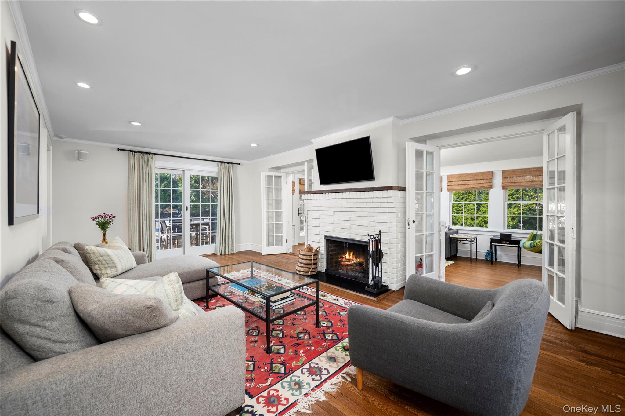 123 Ellison Avenue Bronxville, NY 10708 - Photo 6 of 27 a living room with furniture and a fireplace