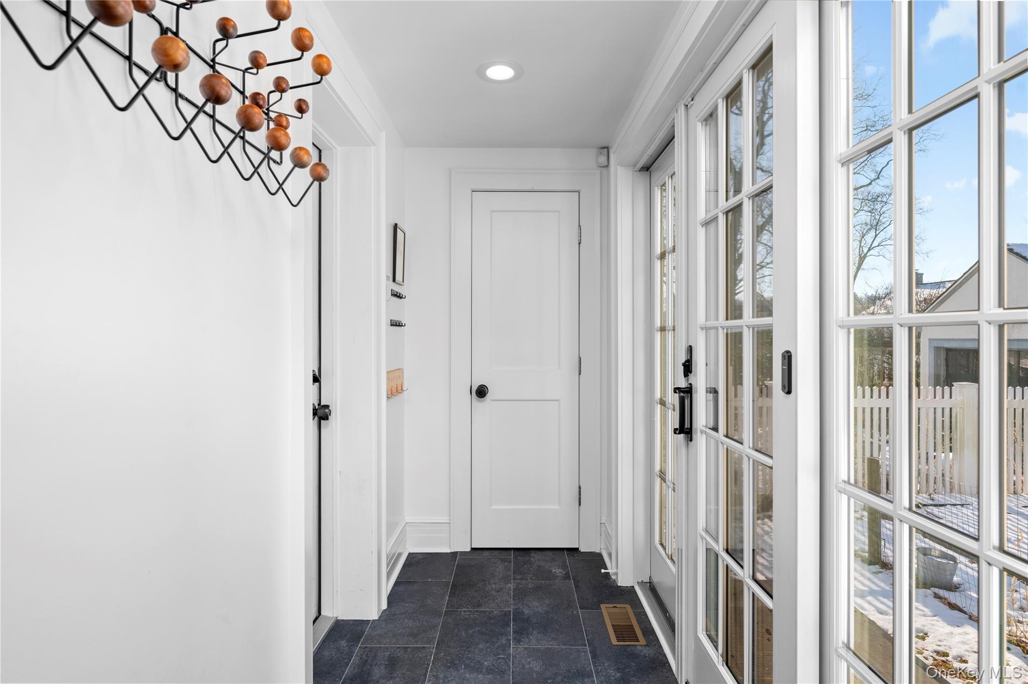 123 Ellison Avenue Bronxville, NY 10708 - Photo 10 of 27 a view of a hallway with wooden floor and staircase