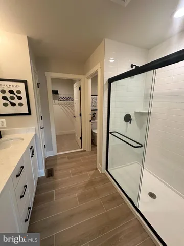 a bathroom with a shower and a tub