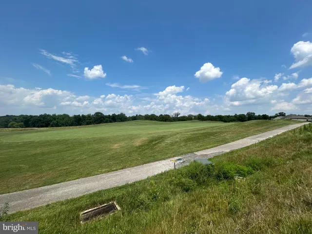 a view of a lake with a big yard