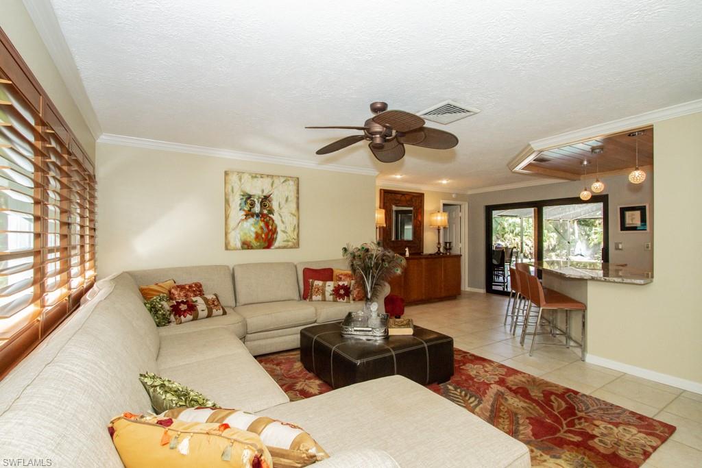 4525 North Road Naples, FL 34104 - Photo 3 of 33 a living room with furniture and wooden floor