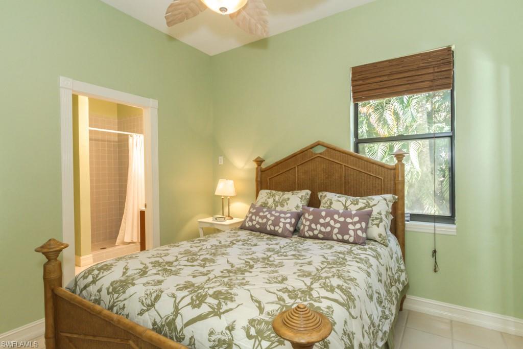 4525 North Road Naples, FL 34104 - Photo 32 of 33 a bedroom with a bed and a window