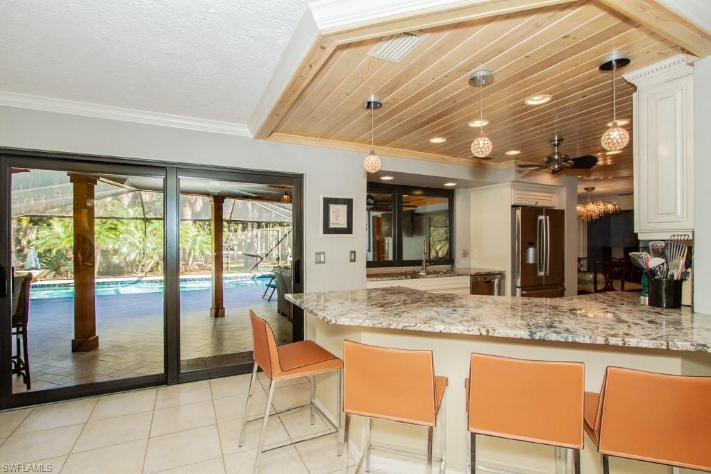 4525 North Road Naples, FL 34104 - Photo 6 of 33 a dining hall with stainless steel appliances granite countertop a granite counter tops and a large window