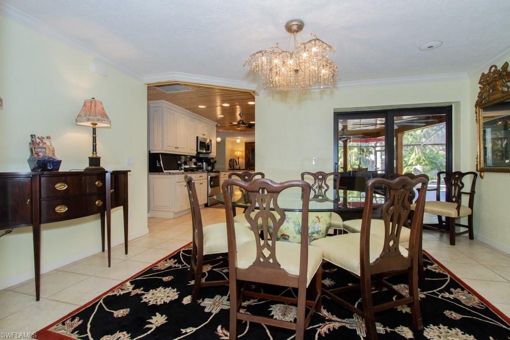4525 North Road Naples, FL 34104 - Photo 8 of 33 a view of a dining room with furniture