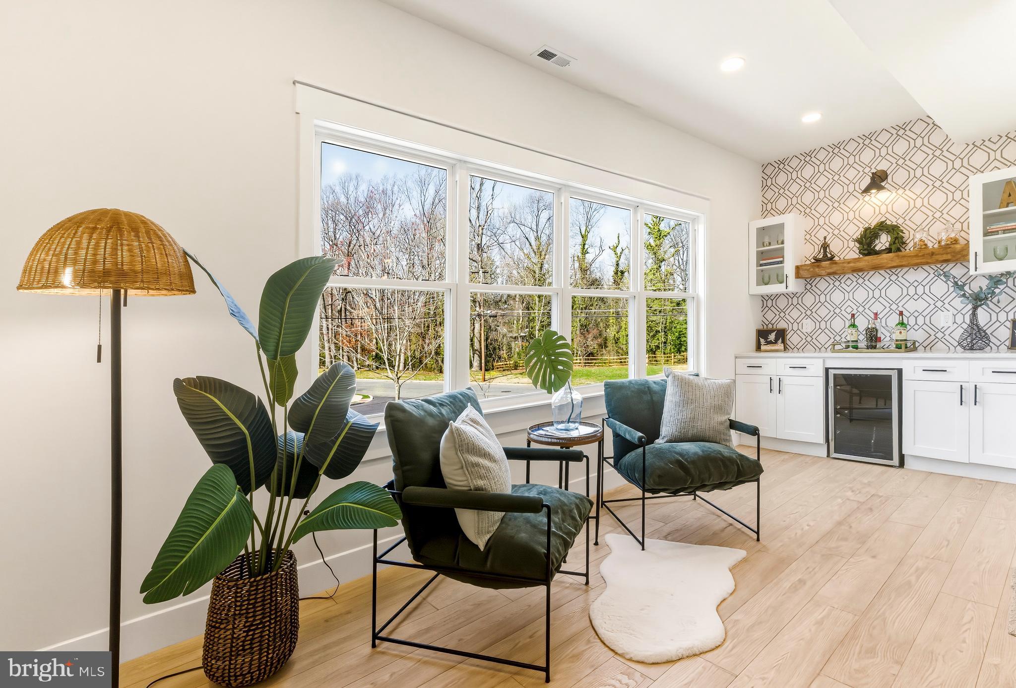 451 Alcyon Boulevard Pitman, NJ 08071 - Photo 13 of 32 a living room with furniture and a large window