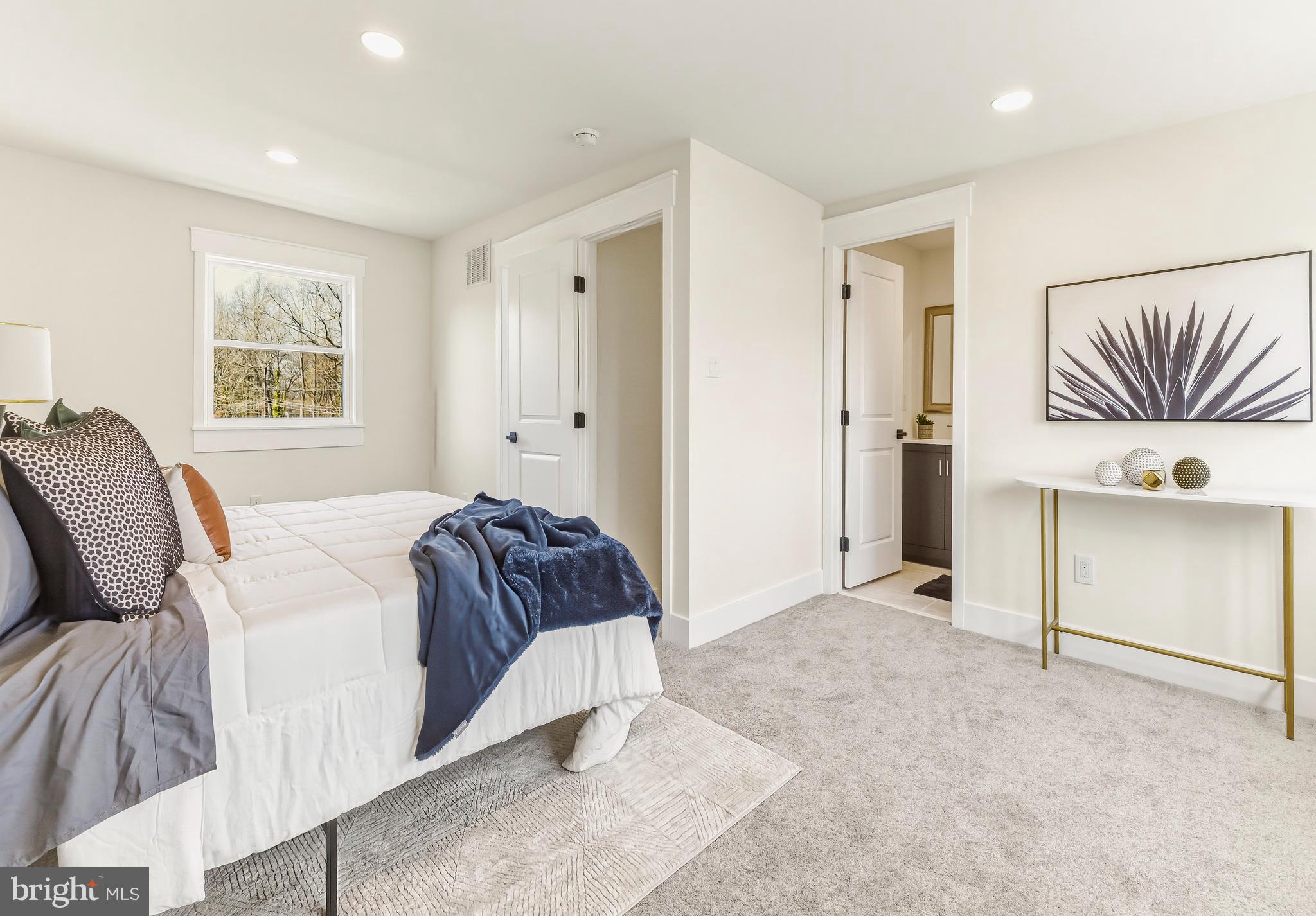 451 Alcyon Boulevard Pitman, NJ 08071 - Photo 18 of 32 a bedroom with a bed and a painting on the wall