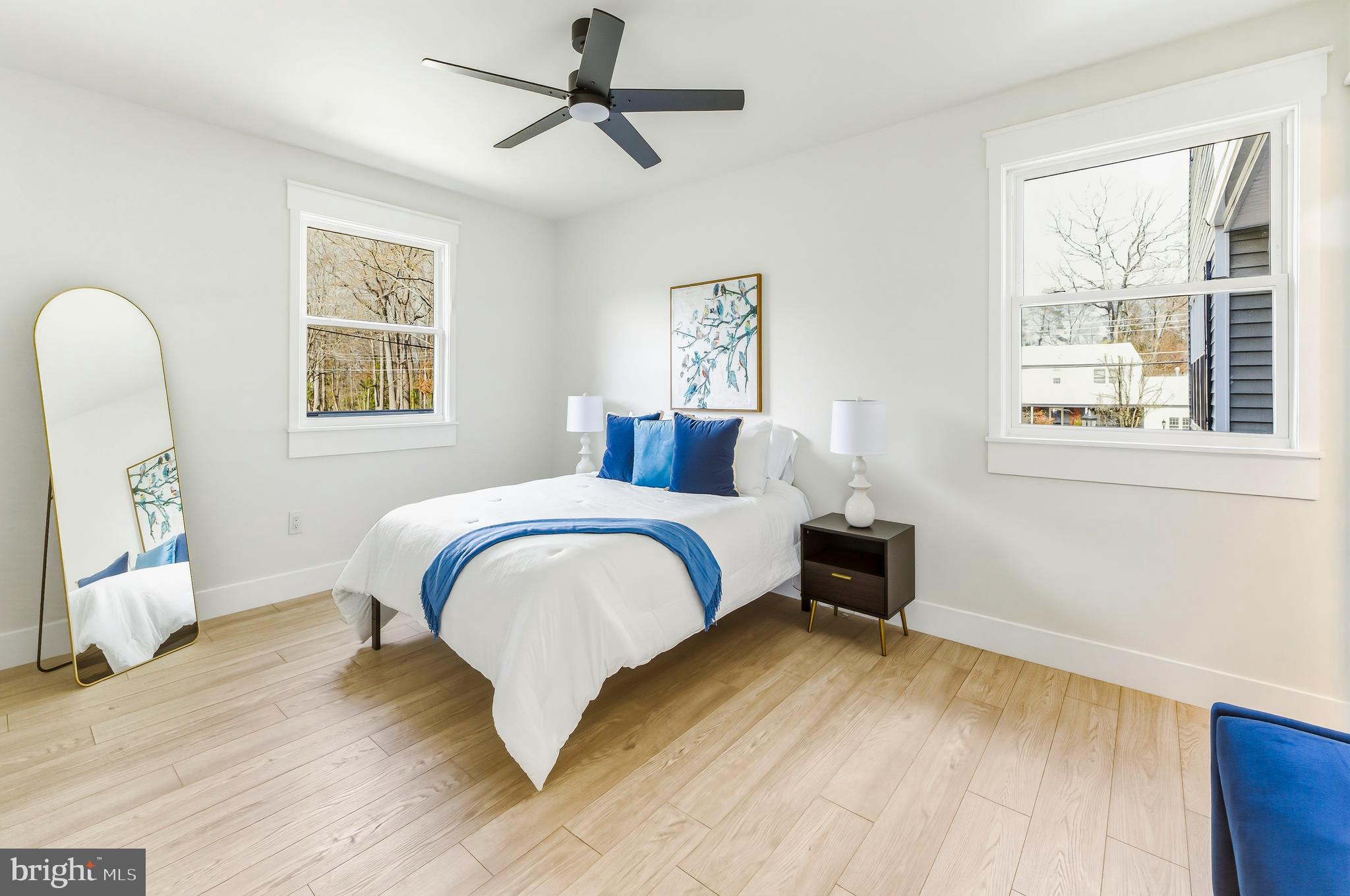 451 Alcyon Boulevard Pitman, NJ 08071 - Photo 21 of 32 a bedroom with a bed and wooden floor