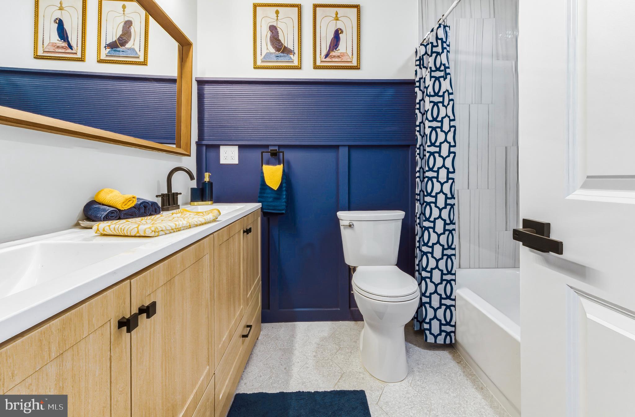 451 Alcyon Boulevard Pitman, NJ 08071 - Photo 25 of 32 a bathroom with a toilet sink and mirror