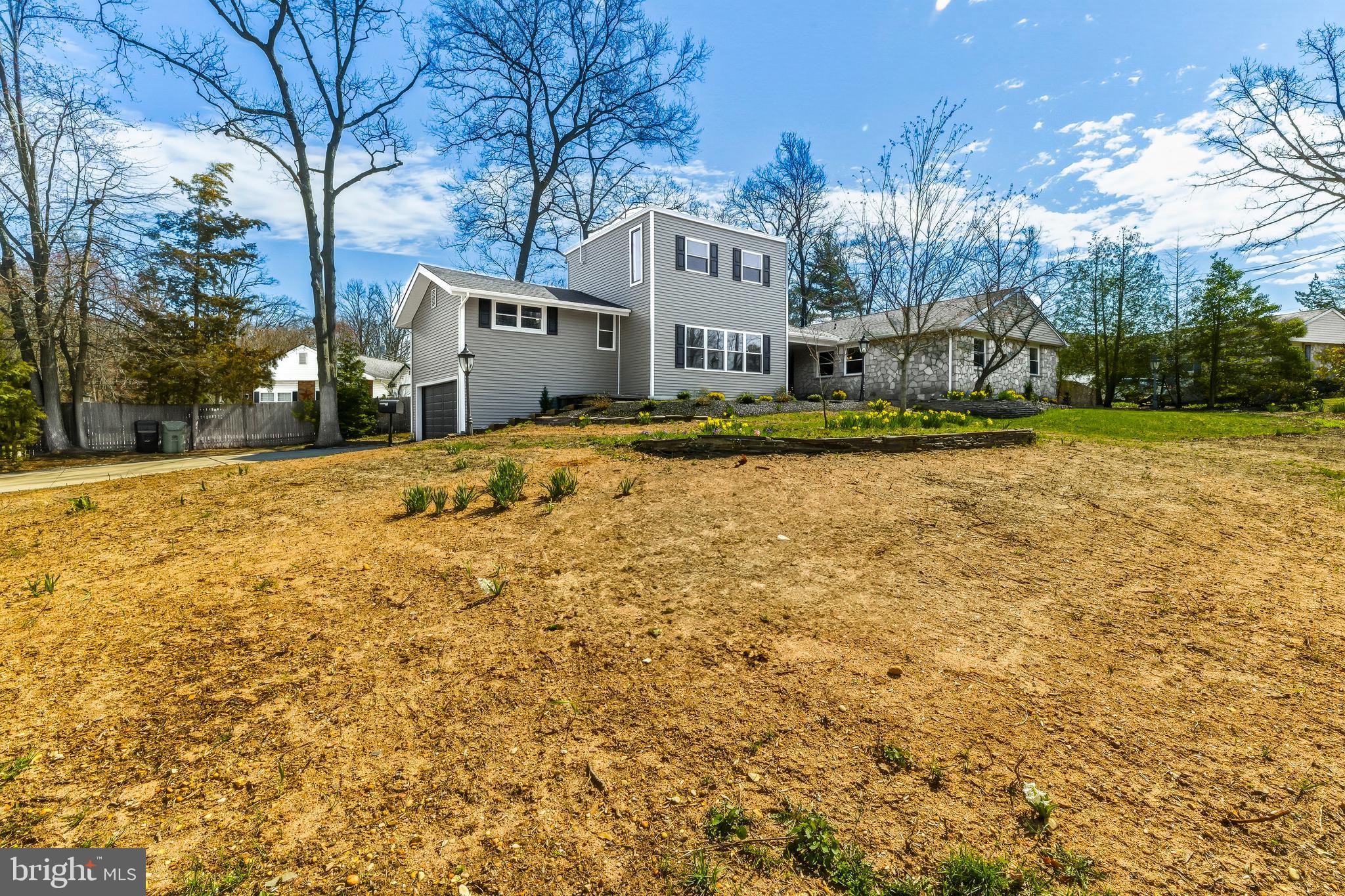 451 Alcyon Boulevard Pitman, NJ 08071 - Photo 32 of 32 a front view of a house with a yard and garage