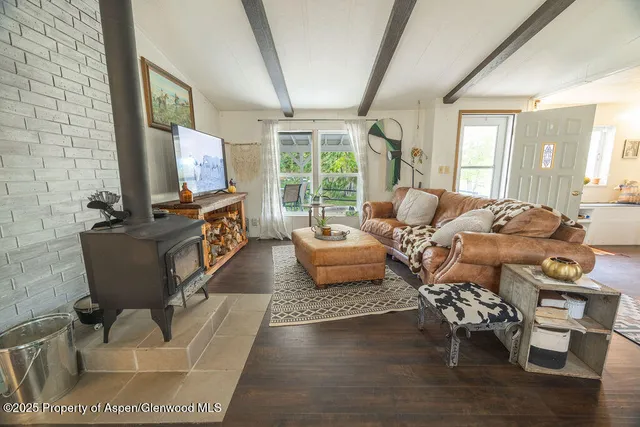 a view of hall way with furniture and a window