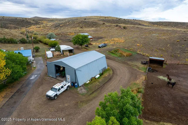 a view of walk in closet with clothes