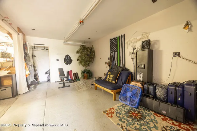 a view of a dry yard with wooden fence