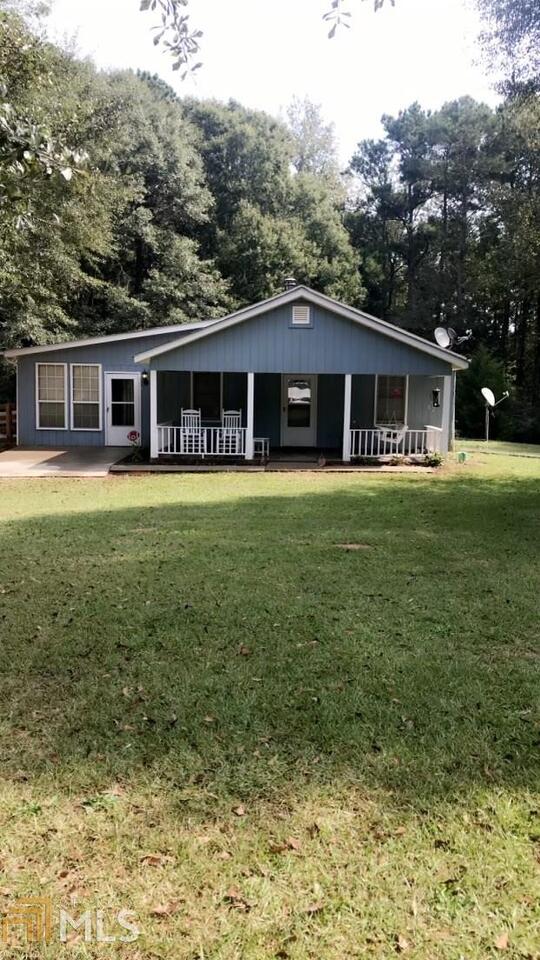 421 Collier Road Concord, GA 30206 - Photo 1 of 1 a front view of a house with a garden
