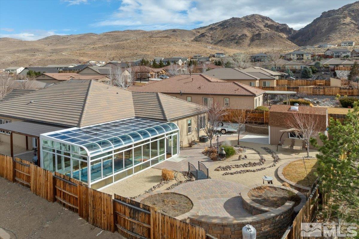 10245 Cavalry Circle Reno, NV 89521 - Photo 32 of 40 an aerial view of a house with swimming pool and mountain view