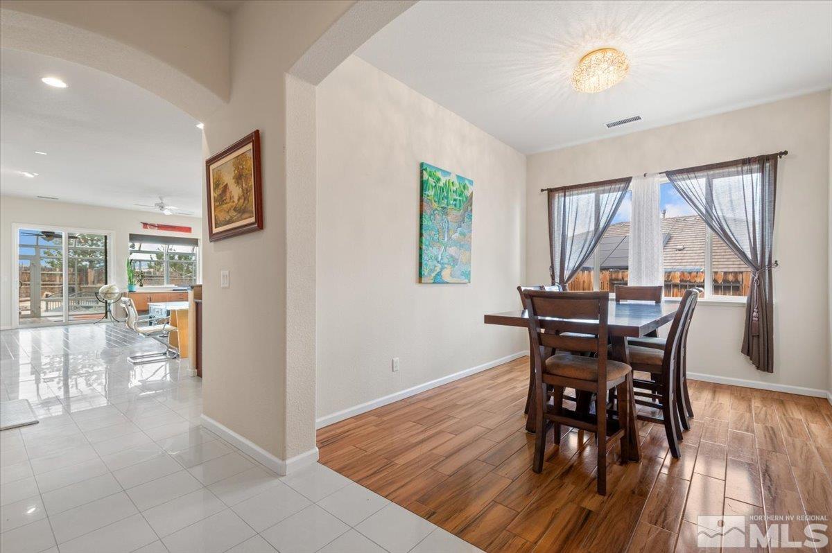 10245 Cavalry Circle Reno, NV 89521 - Photo 4 of 40 a view of a dining room with furniture and wooden floor