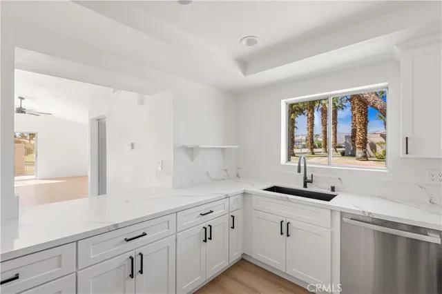 a kitchen with a sink and cabinets
