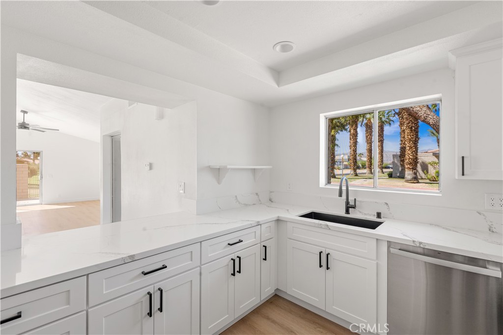 82151 Waring Way Indio, CA 92201 - Photo 17 of 22 a kitchen with a sink and cabinets