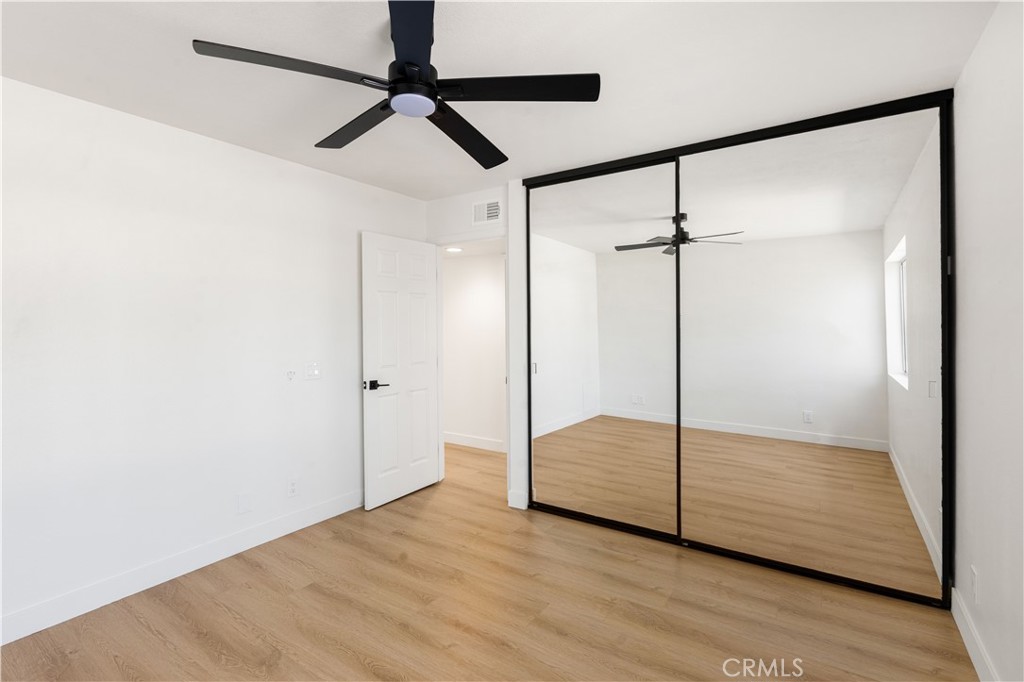82151 Waring Way Indio, CA 92201 - Photo 19 of 22 a view of empty room with wooden floor