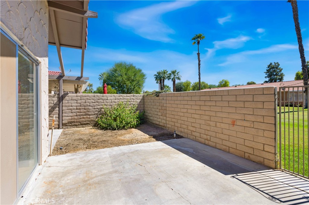 82151 Waring Way Indio, CA 92201 - Photo 20 of 22 a view of a pathway along the building