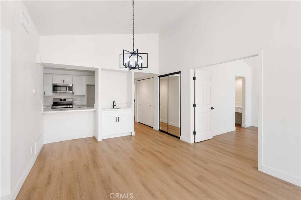 82151 Waring Way Indio, CA 92201 - Photo 4 of 22 a view of a kitchen with cabinet and a ceiling fan
