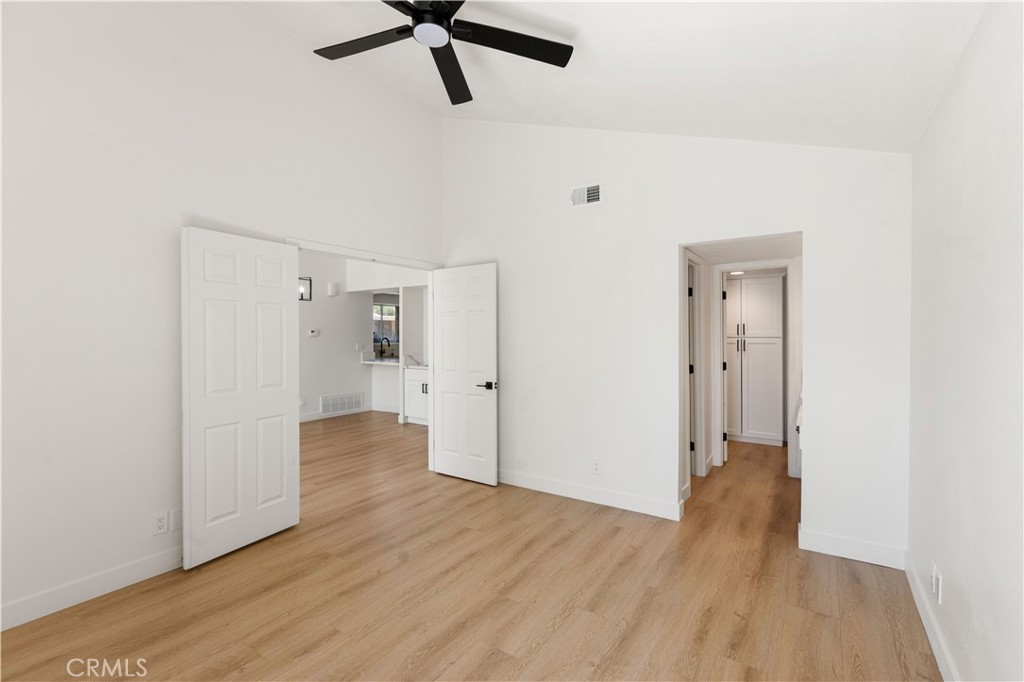 82151 Waring Way Indio, CA 92201 - Photo 8 of 22 a view of a room with wooden floor and white walls