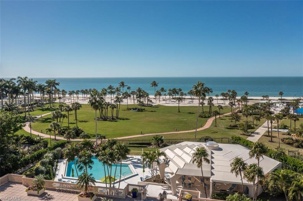 4031 Gulf Shore Boulevard North, Unit 6B Naples, FL 34103 - Photo 33 of 37 Aerial view of a pool area and a large body of water
