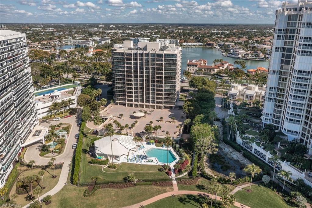 4031 Gulf Shore Boulevard North, Unit 6B Naples, FL 34103 - Photo 36 of 37 View of urban area with a pool area and a large body of water