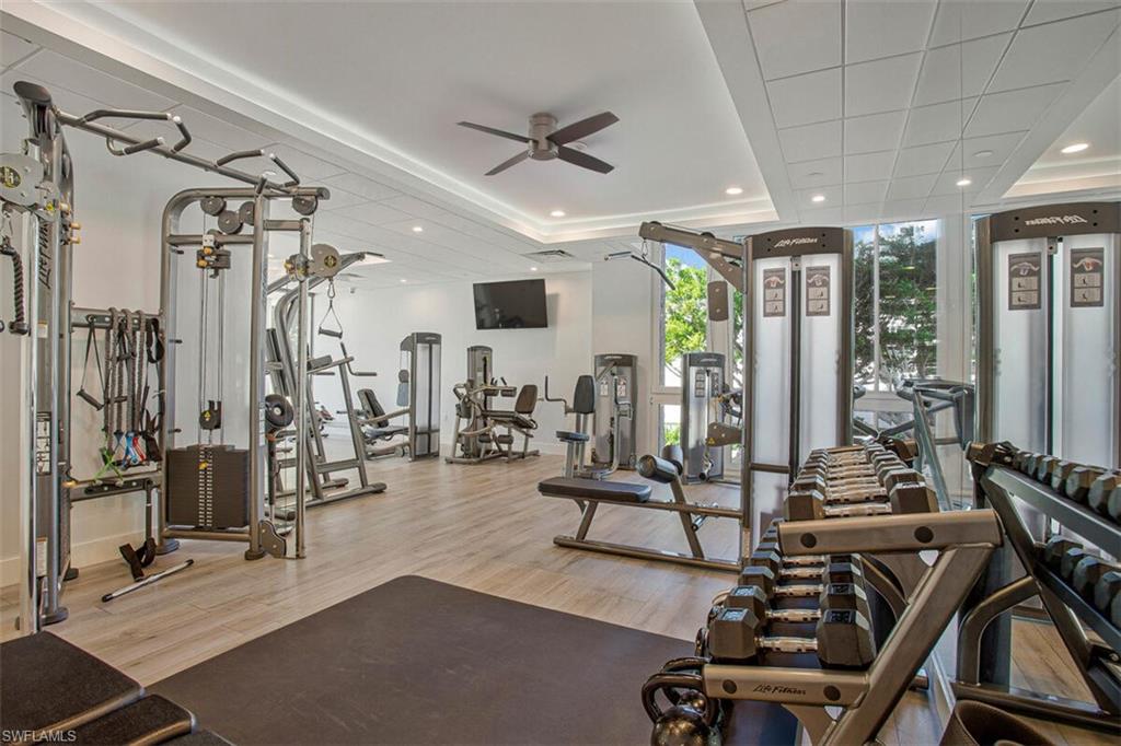 4031 Gulf Shore Boulevard North, Unit 6B Naples, FL 34103 - Photo 4 of 37 Gym with recessed lighting, ceiling fan, and expansive windows