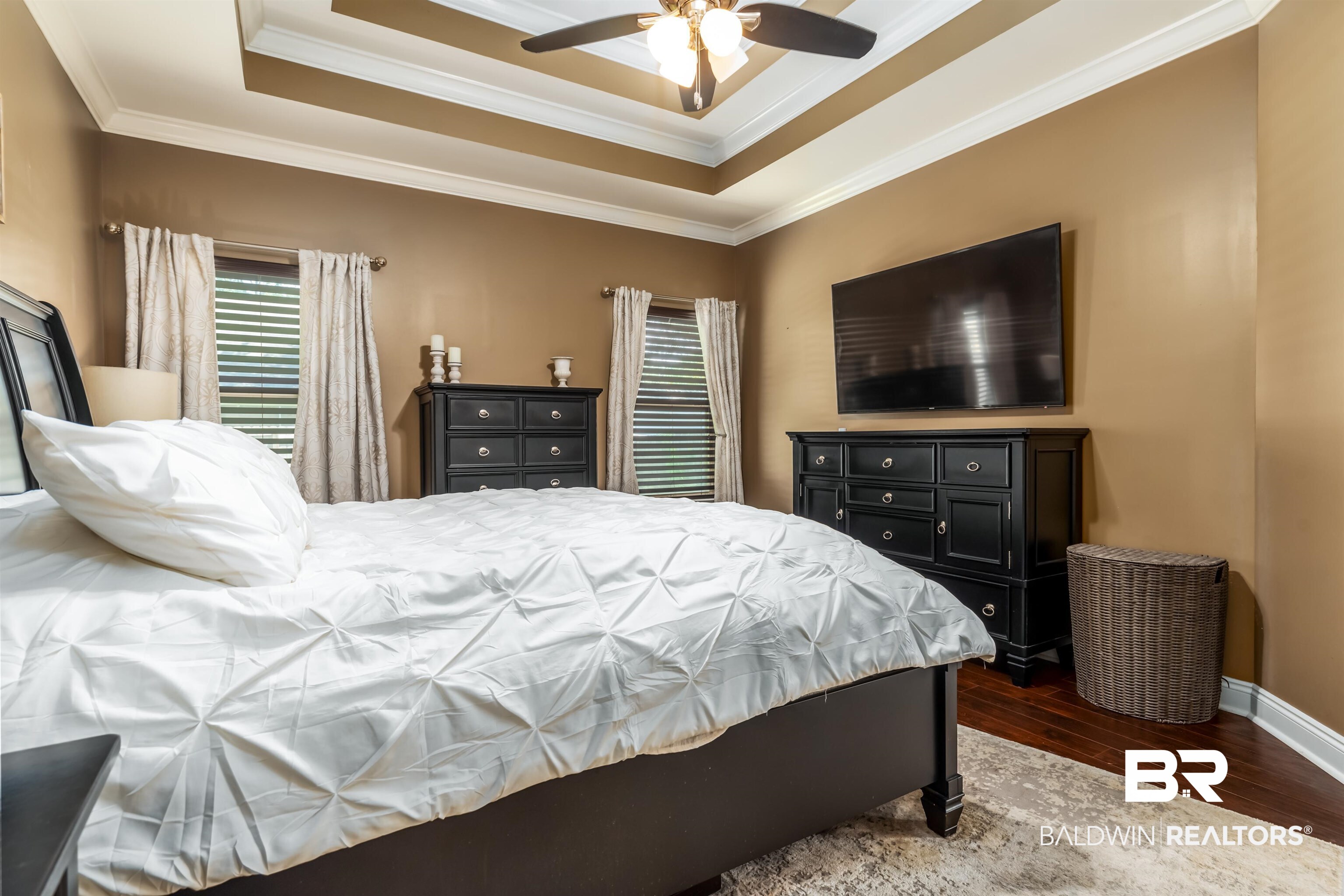 965 Henckley Avenue Mobile, AL 36609 - Photo 12 of 30 Bedroom with ceiling fan, crown molding, a tray ceiling, and dark wood-type flooring