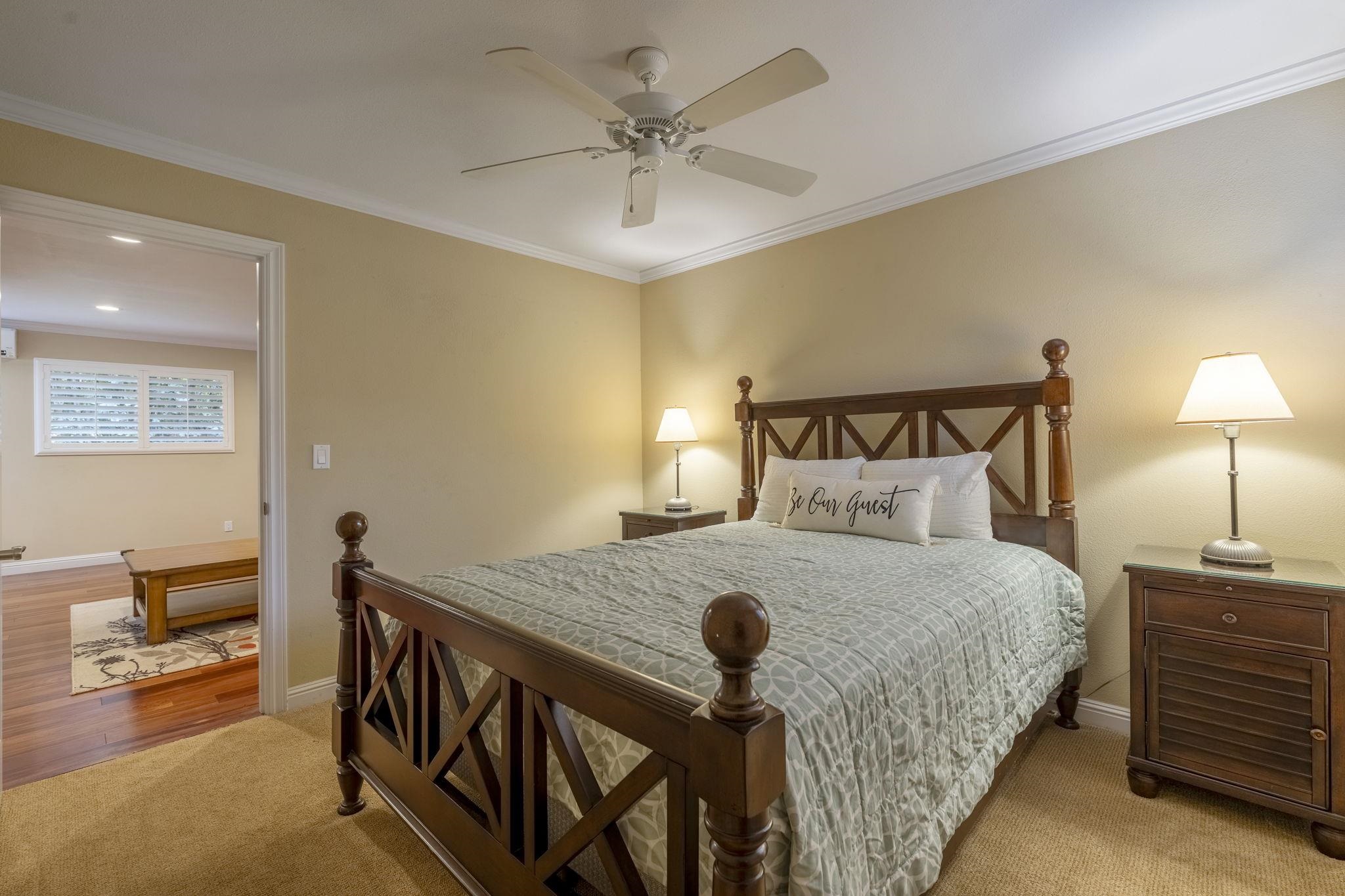 4087 North Paua Way Lahaina, HI 96761 - Photo 35 of 50 a bedroom with a bed and a chandelier