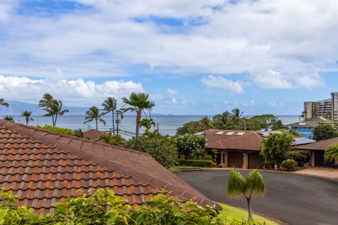 a view of a garden with sitting area